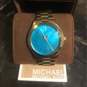 New Michael Kors watch w o tags. gold w blue face!